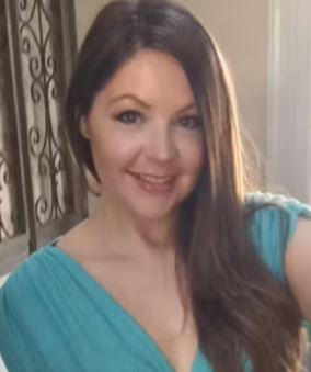 UNDERSTANDING THE KETO DIET. MELISSA POSES AFTER LOSING A LOT OF WEIGHT. SHE IS WEARING A BLUE DRESS.