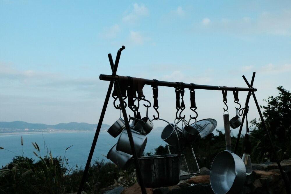 Camping cookware hanging up to dry