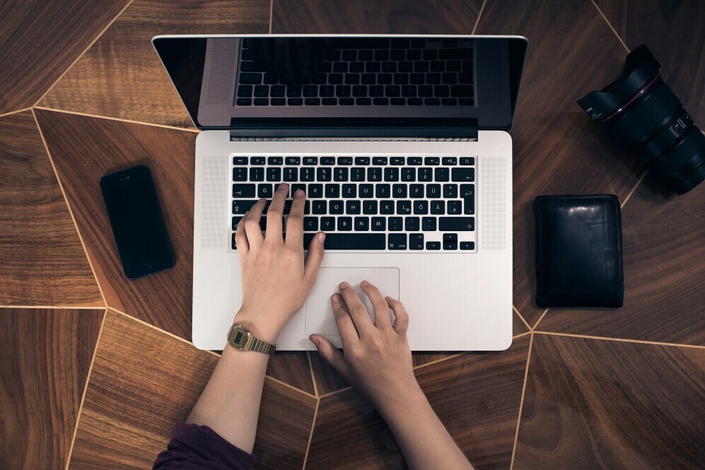 A person researching on a laptop.