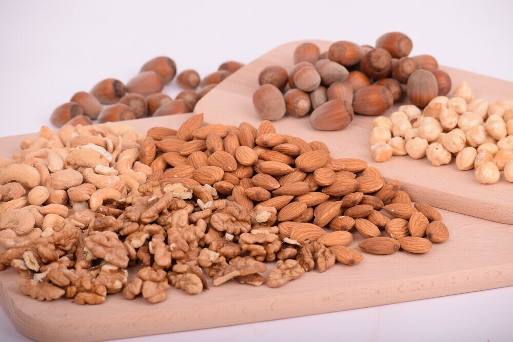 Image of assorted nuts on wooden boards