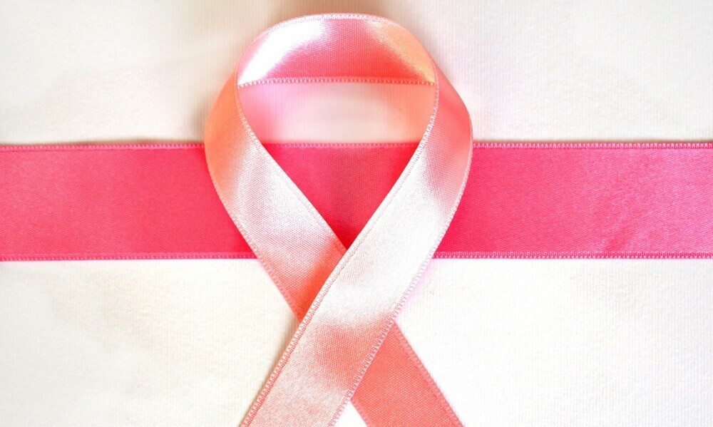 Mistletoe and Cancer Support: Pink ribbon symbol of fight against cancer