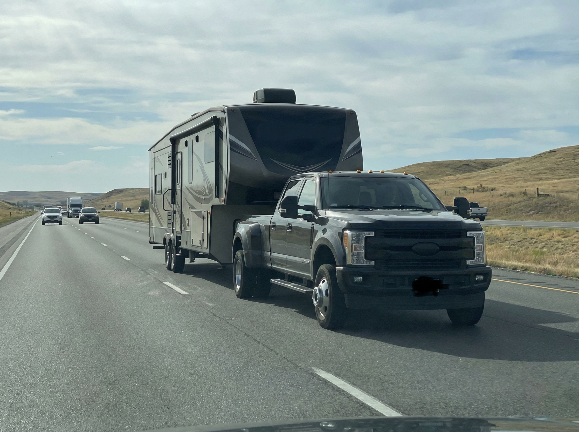 Heavy-duty dually towing a fifth wheel on the highway