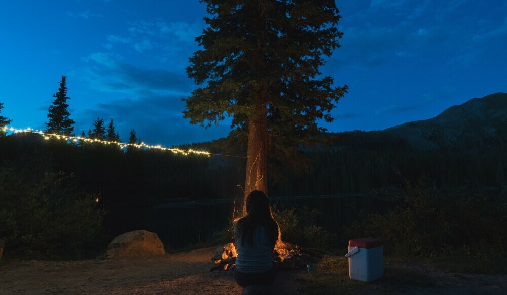 Off-Grid setup with led light string. Warming up by the fire.