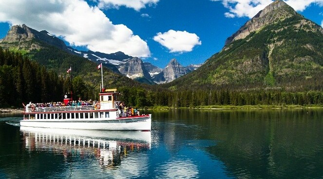 Tour boat full of people on Waterton Lake