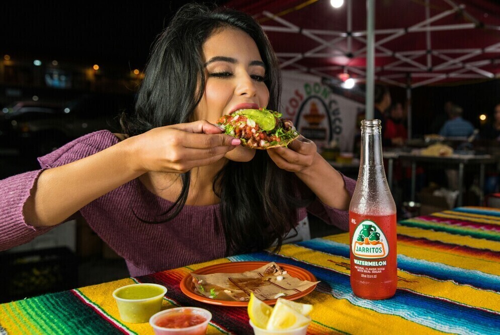 Enjoying  her taco!