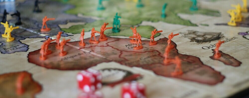 A Risk board set up with counters
