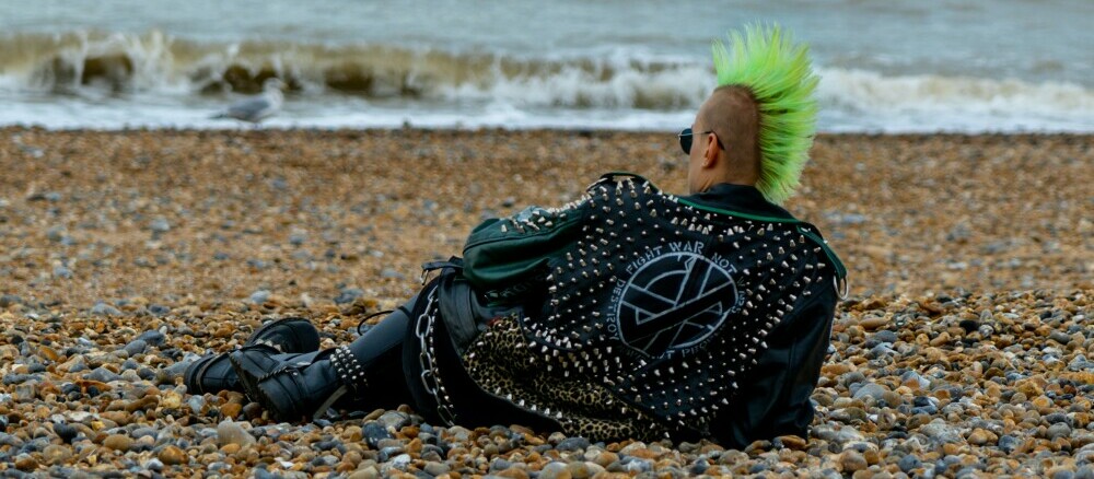 A punk rocker with green Mohican on Brighton Beach