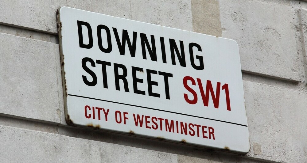 street sign showing Downing Street SW1