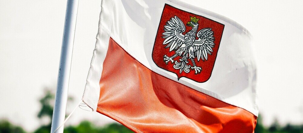 A Polish flag on a flag pole