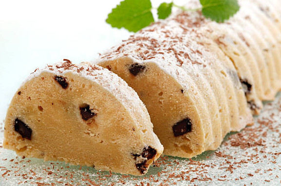 Stollen Cake Ice Cream Recipe - A Taste Of Germany image 4 stollen cake ice cream sliced to show internal fruits frosted fusions