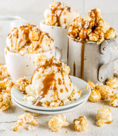 Transform Movie Nights With Delicious Homemade Popcorn Ice Cream image 5 cups and dishes filled and spilling over with ice cream popcorn and caramel sauce frosted fusions