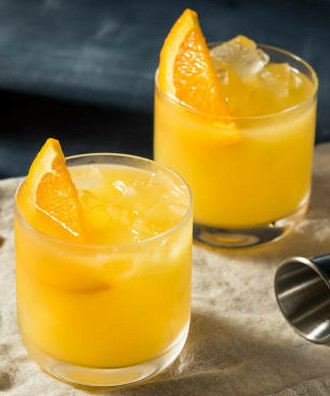 Whip up a Boozy Homemade Vodka and Orange Sorbet image 1 two tumblers of vodka and orange with slices of orange and ice frosted fusions