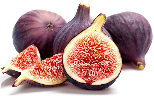 Homemade Fig And Honey Ice Cream Recipe image 1 handful of figs some sliced displaying internal flesh white background