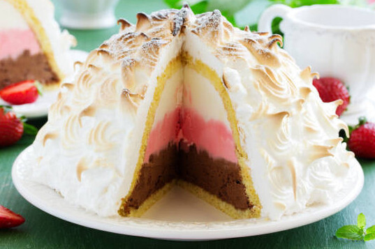 Prosecco And Strawberry Ice Cream Recipe For Your New Year's Celebrations! image 3 baked alaska with wedge cut out to show internal layers frosted fusions