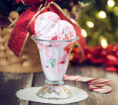 20 Festive Winter Ice Cream Recipe Ideas image 4 candy cane ice cream sundae with candy canes and christmas decor frosted fusions