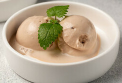 Baileys and White Chocolate Homemade Ice Cream Boozy Rich Indulgence image 3 baileys and white chocolate ice cream with fresh mint leaves frosted fusions