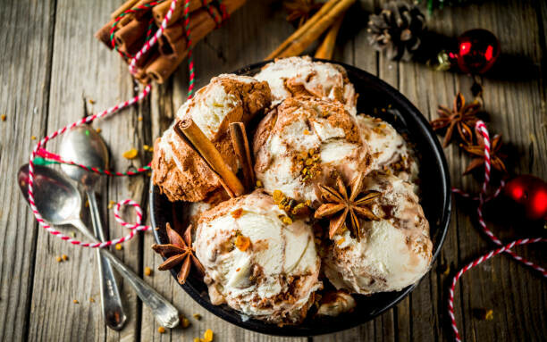 Festive Homemade Ice Cream Flavours for a Cosy and Delicious Christmas image 12 eggnog ice cream with cinnamon sticks and star anise christmas baubles frosted fusions