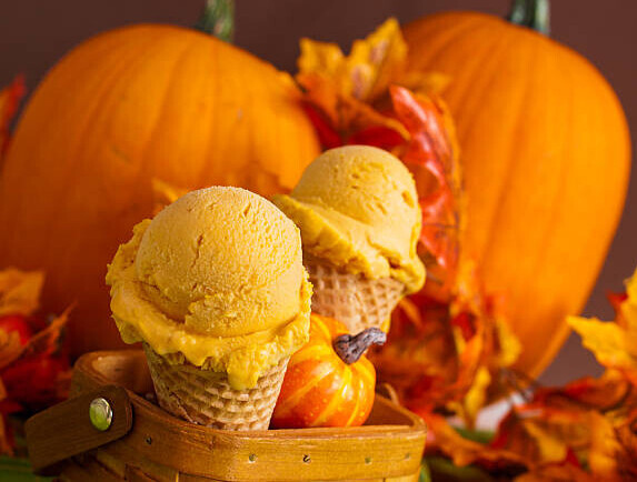 Cosy Homemade Ice Cream And Seasonal Recipes To Welcome Autumn image 1 pumpkin ice cream in cones with pumpkins in the background frosted fusions