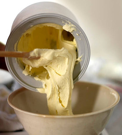 Boxing Day Leftovers! Turn Christmas Flavours Into Ice Cream Treats image 6 vanilla ice cream being poured from an ice cream churn frosted fusions