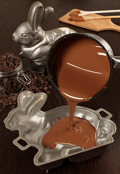 Easter Eggs-travaganza Homemade Easter Egg Ice Cream Ideas image 8 melted chocolate being poured into easter bunny mould frosted fusions