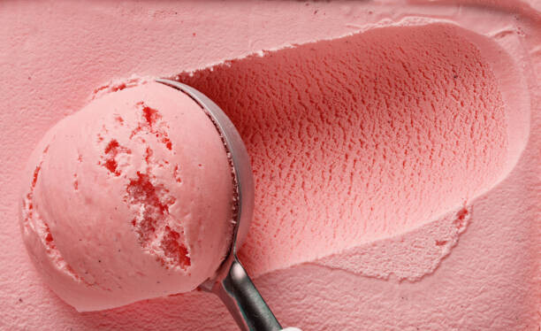 How to Store Homemade Ice Cream To Prevent Freezer Burn image 6 strawberry ice cream being scooped frosted fusions