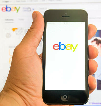 Maximise Your Earnings Learn How To Make Money Online With EBay image 4 mobile phone with ebay icon background is a computer screen with ebay page opened make money selling make xtra money online