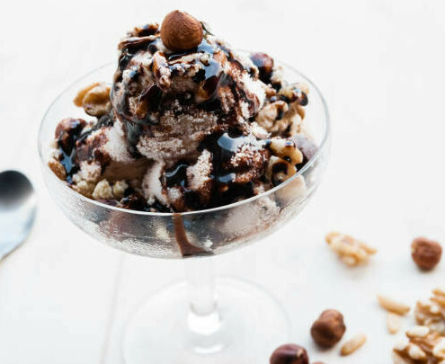 Why Is My Homemade Ice Cream So Hard image 8 delicious chocolate ice cream topped with hazelnuts and chocolate fudge sauce frosted fusions