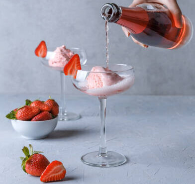 Prosecco And Strawberry Ice Cream Recipe For Your New Year's Celebrations! image 2 prosecco being poured into ice cream dishes to make an ice cream float frosted fusions