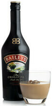 Baileys and White Chocolate Homemade Ice Cream Boozy Rich Indulgence image 1 bottle of baileys and glass of baileys with ice white background frosted fusions