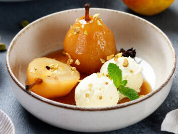 Autumn Fruits Transformed Into Caramelised Cosy And Comforting Homemade Ice Cream image 4 bowl of ice cream with caramelised pears with fresh pears and cinnamon sticks frosted fusions