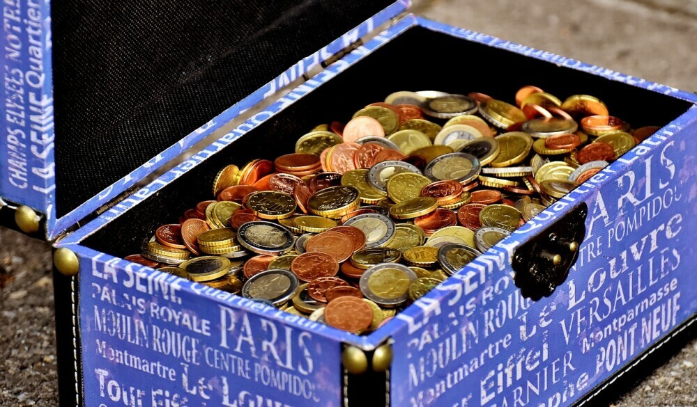 a box full of money coins