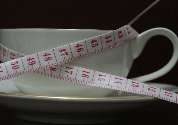Tea cup with tape measure for waist