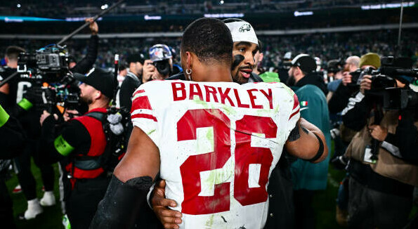 Saquon Barkley embracing Jalen Hurts after a game.