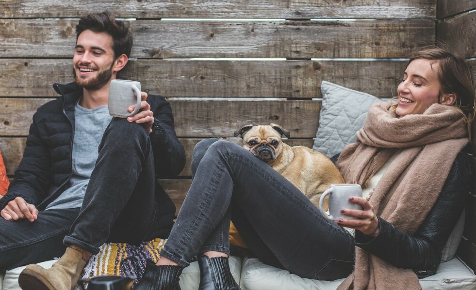 Couple having fun with their dog