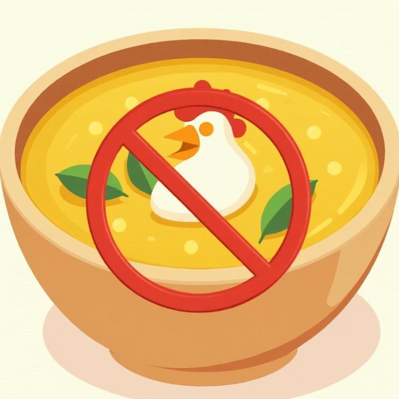 A bowl of soup with a chicken head in it and a banned symbol to signify the banning of chicken noodle soup