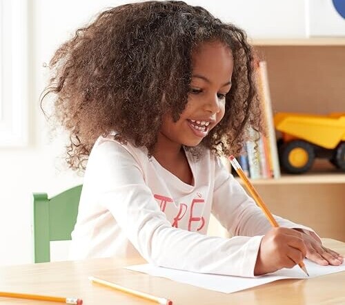 Young girl using a number 2 pencil