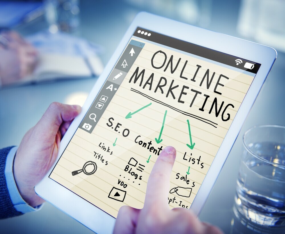 A person using a tablet to learn about affiliate marketing
