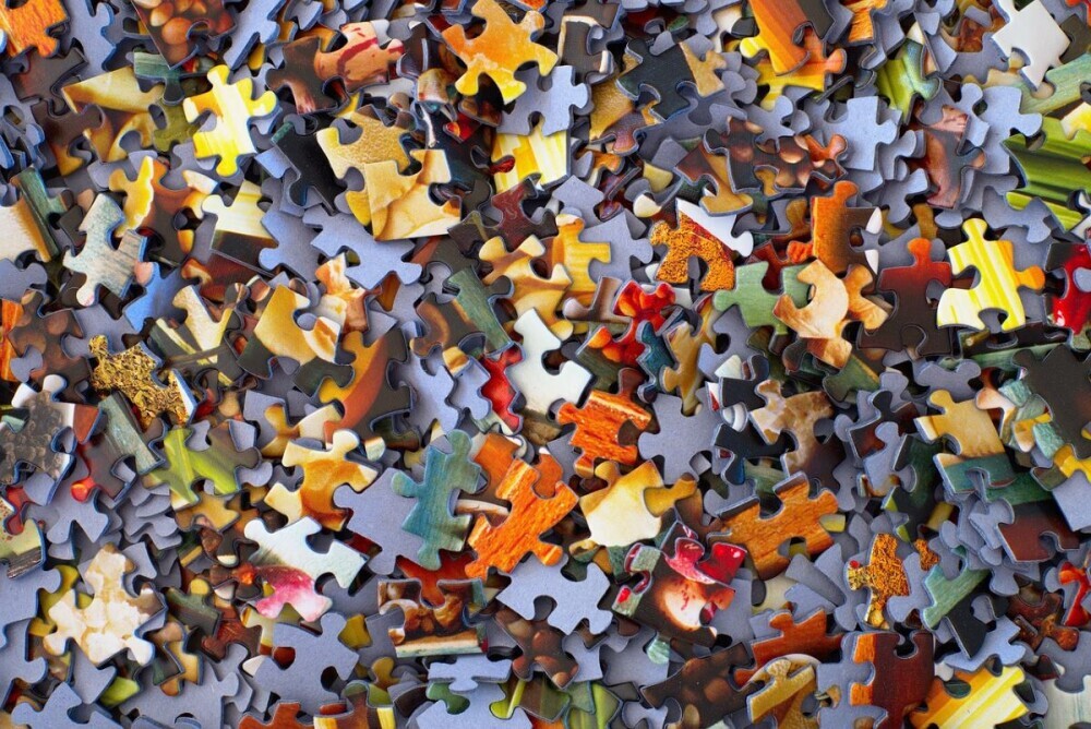 Picture of random scattered jigsaw puzzle pieces