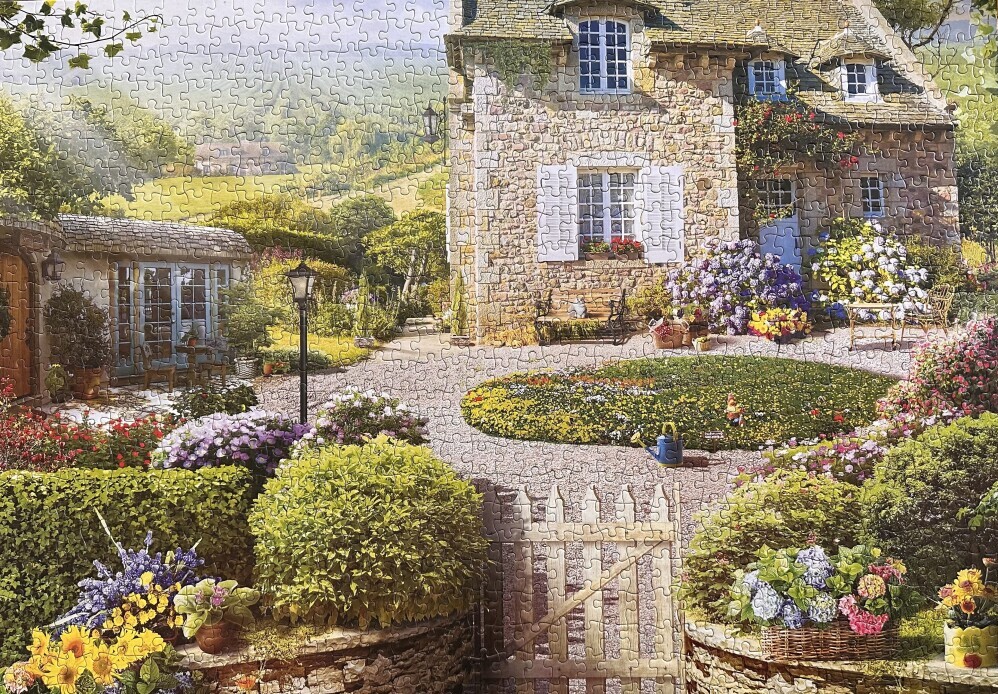picture of country home and garden puzzle to introduce topic of best glue for jigsaw puzzles