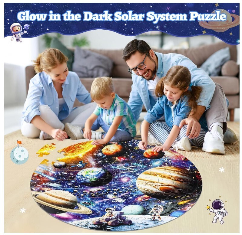 family of 4 that includes two young children assembling solar system glow in the dark jigsaw puzzle
