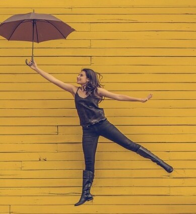 Image of woman jumping for joy