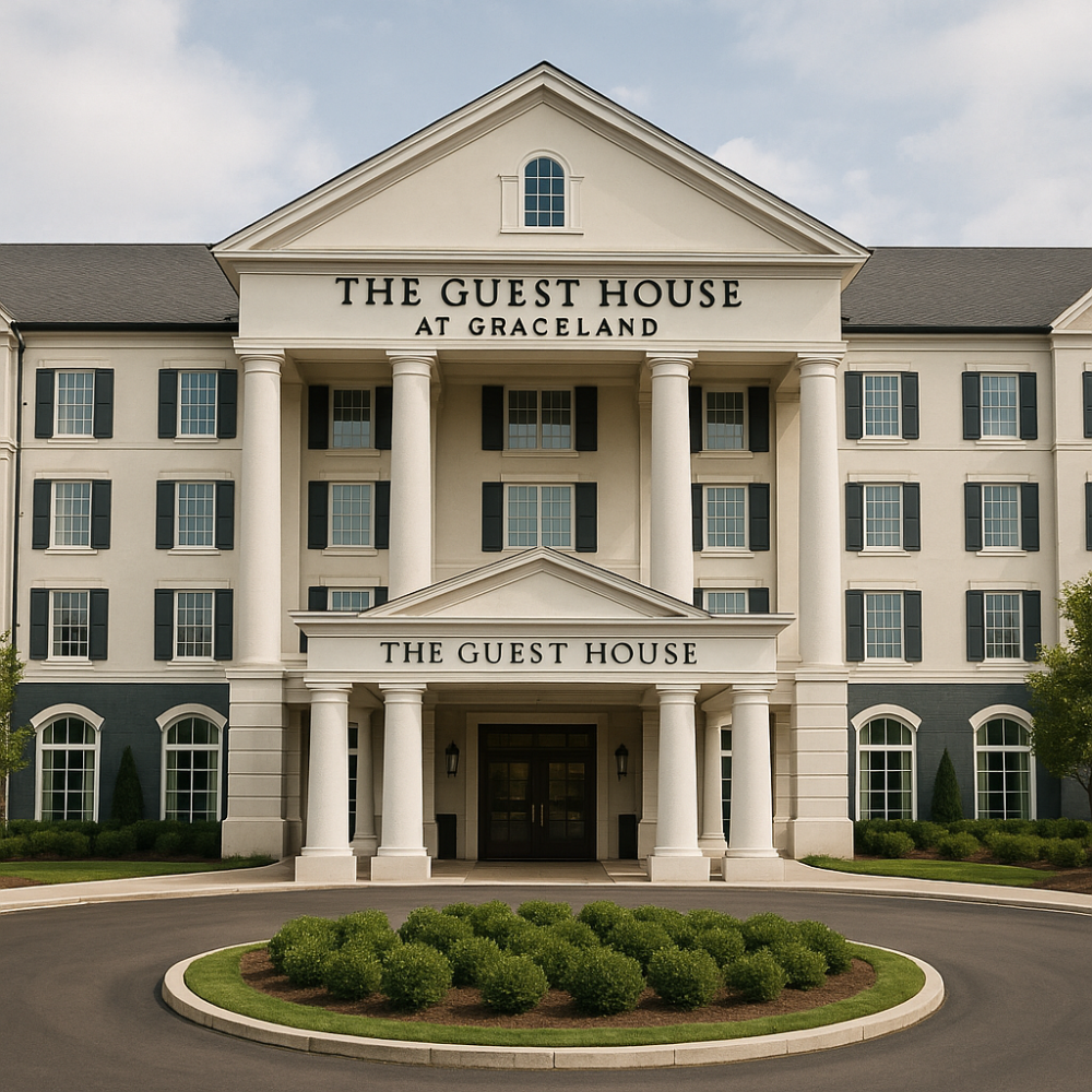 The front entrance of The Guest House at Graceland, a grand, columned hotel with black shutters and manicured landscaping, framed by a circular driveway.