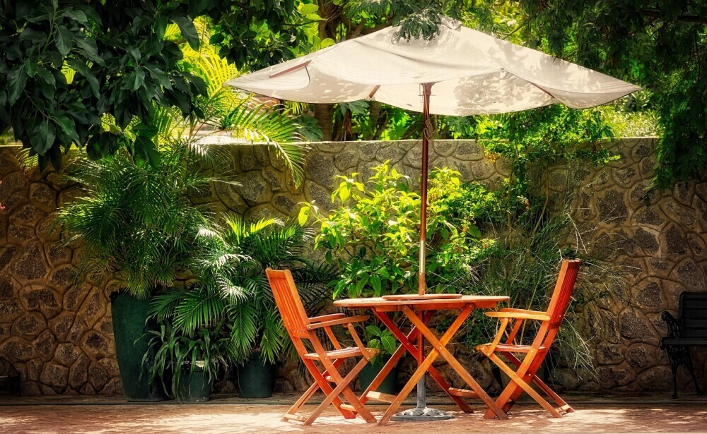 outdoor table and chairs with parasol