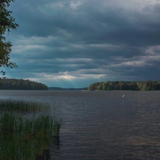 dark clouds above a lake
