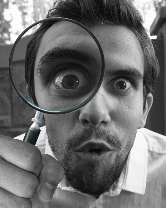inspecting with magnifying glass
