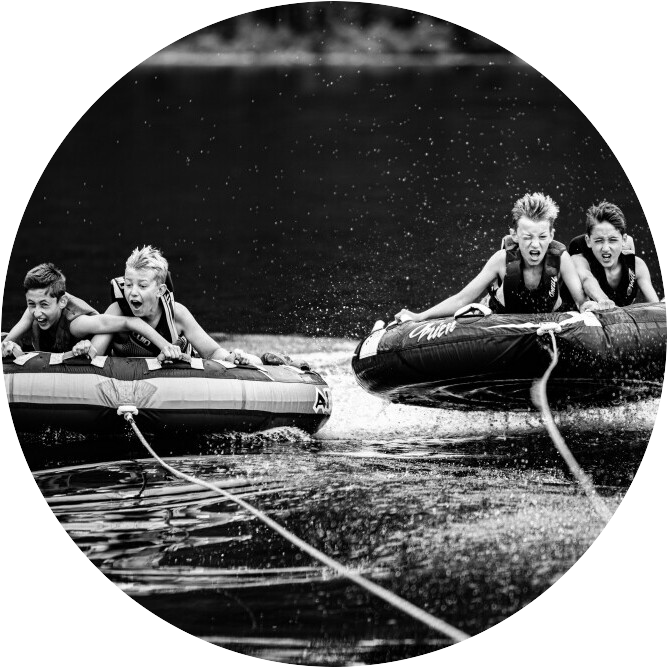 kids tubing on the water