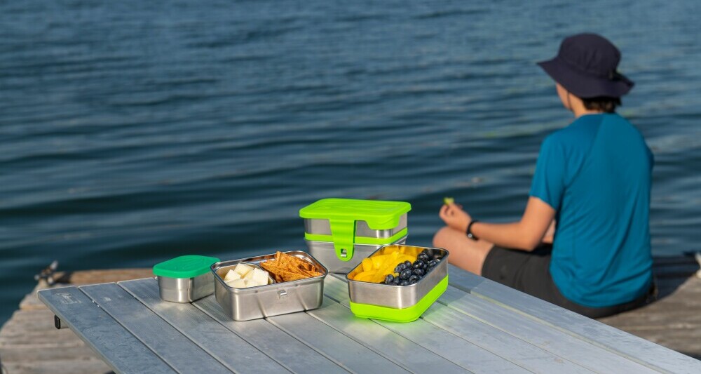 boy eating snacks on the shore