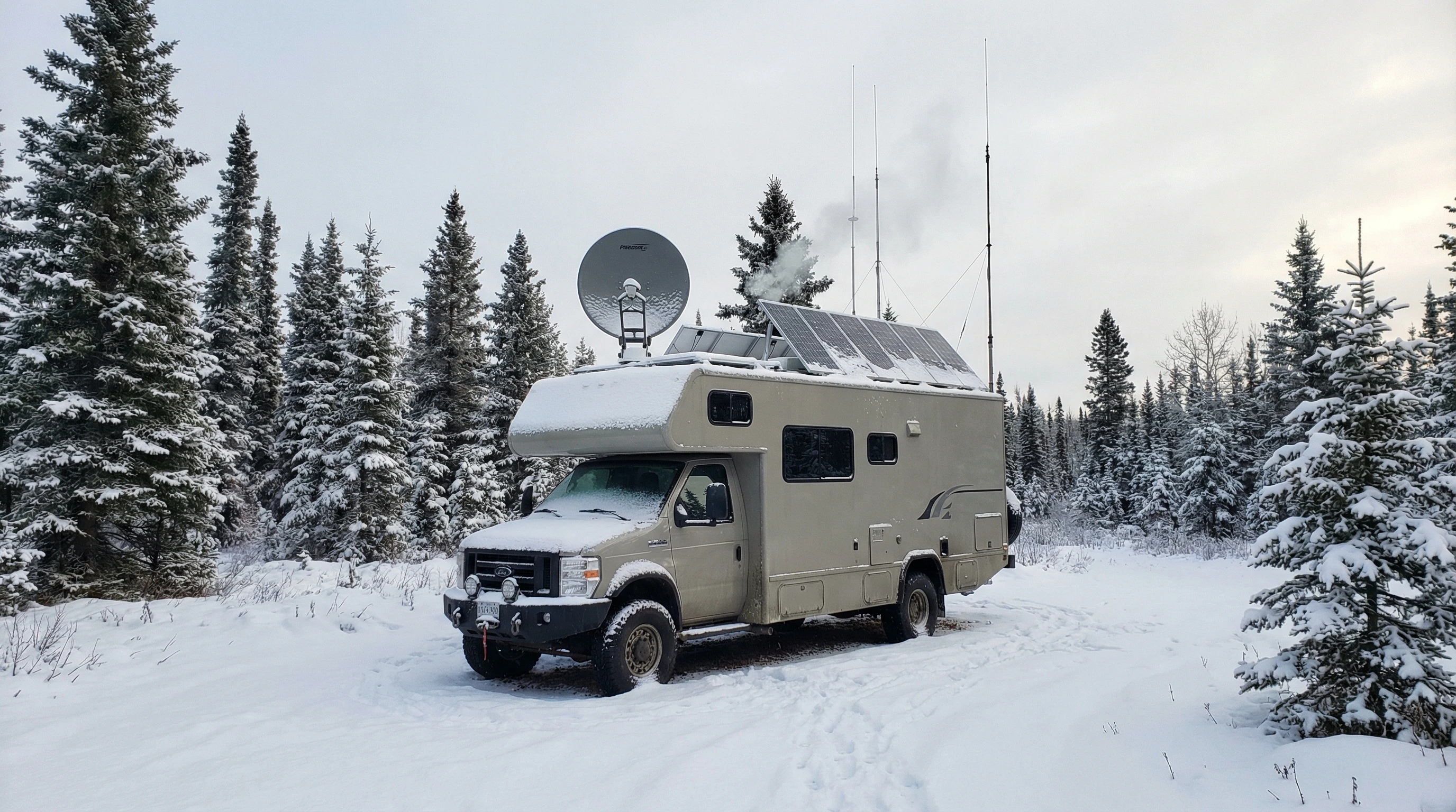 RV communication gear spread out on a picnic table: radios, satellites, solar chargers, and power banks