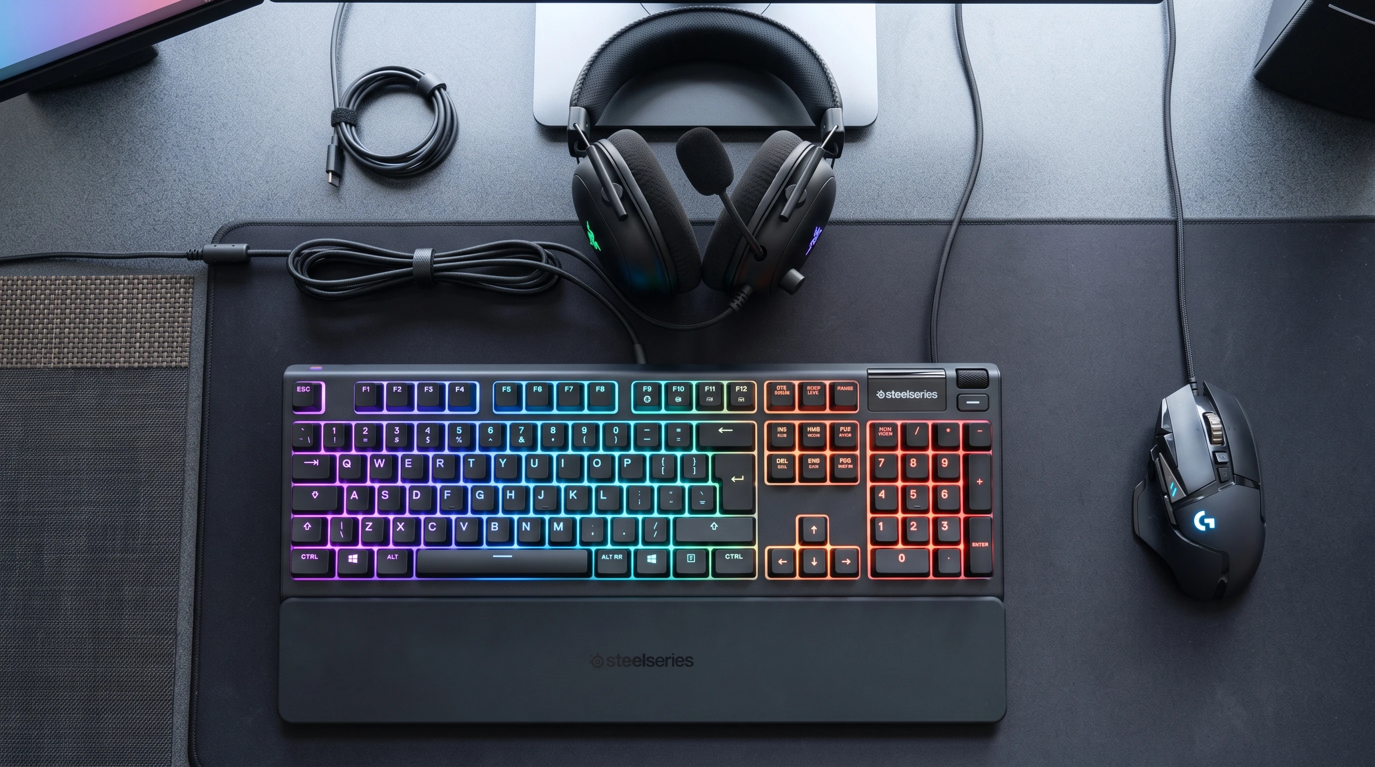 Close-up of a membrane keyboard with colorful lighting, set up for gaming