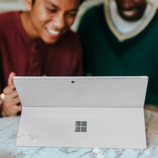 Image of teens looking at screen